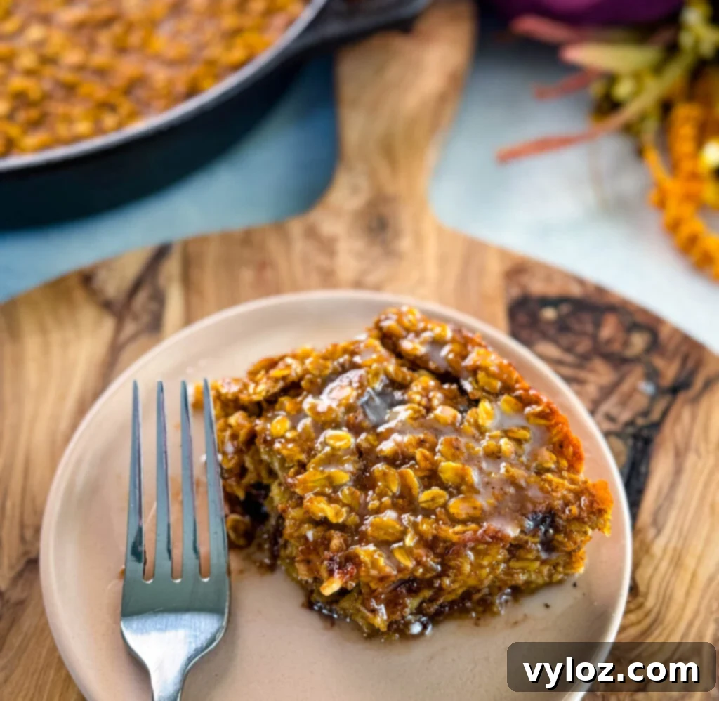 pumpkin baked oatmeal with chocolate chips on a plate with a fork