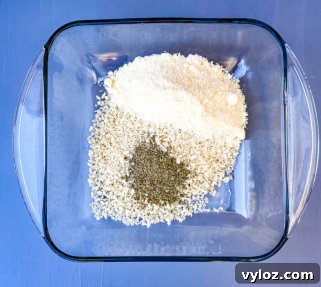 breadcrumbs, parmesan cheese, and Italian seasoning in a large glass bowl