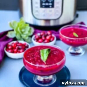 Easy Instant Pot Cranberry Sauce 9 Instant Pot cranberry sauce in a glass bowl, garnished with orange slices and fresh cranberries