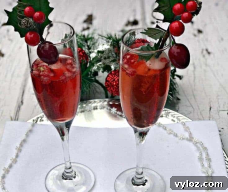 Pomegranate Holiday Mimosas, a vibrant and festive cocktail, ready to be pinned on Pinterest for holiday drink inspiration.