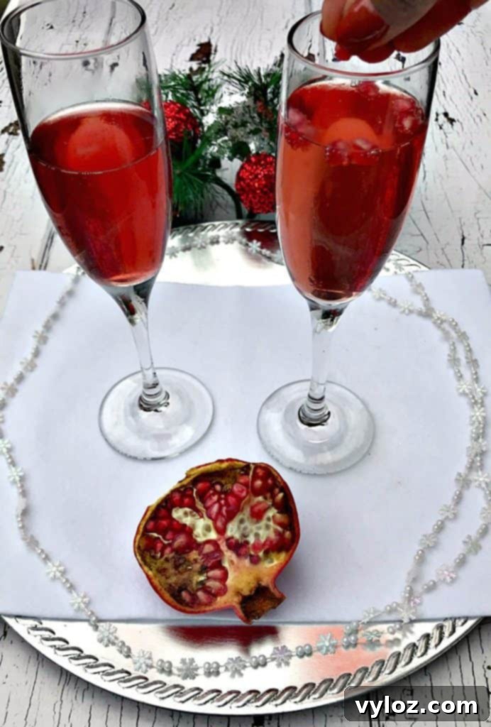 Ruby Red Holiday Fizz 6 Elegant spread of brunch food and Pomegranate Mimosas on an outdoor patio, perfect for a sunny autumn day with friends.