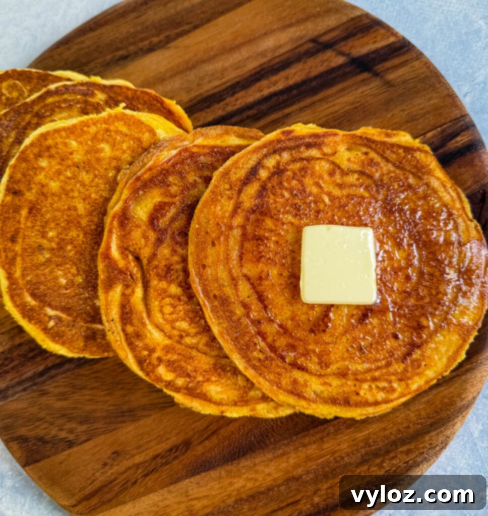 Crispy Golden Fried Cornbread 11 fried cornbread with butter on a plate