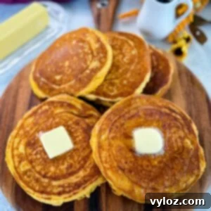 Crispy Golden Fried Cornbread 10 fried cornbread with butter on a plate