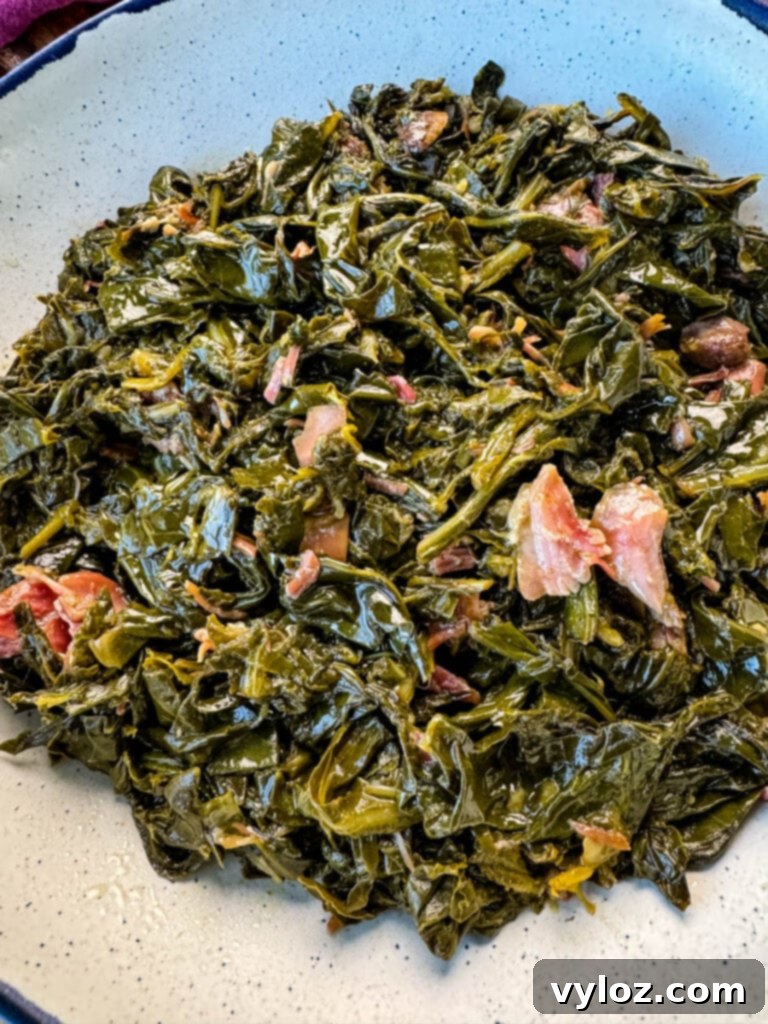 collard greens and ham hocks in a Dutch oven