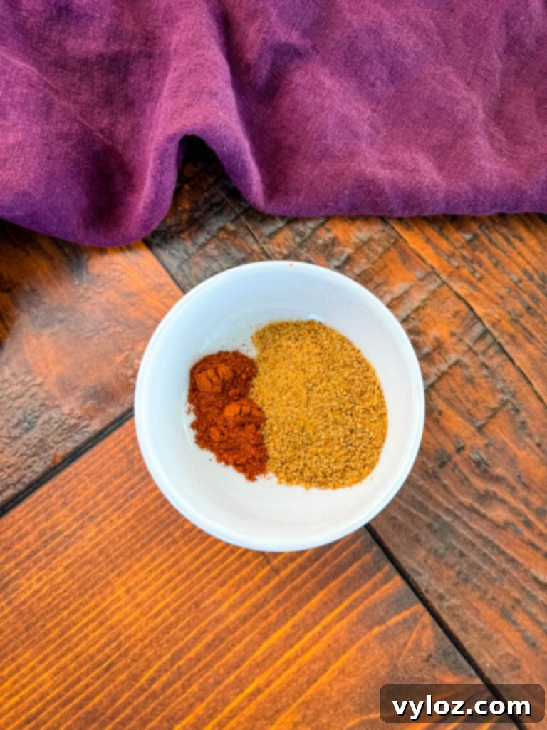 Creole Seasoning and smoked paprika in a white bowl