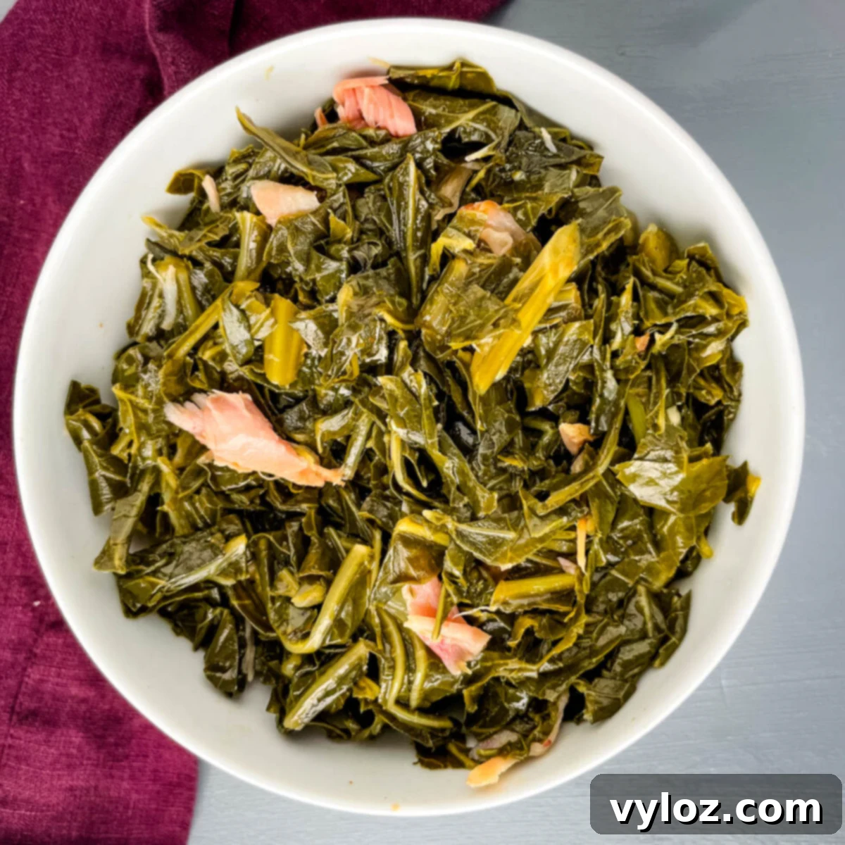 Ultimate Southern Collard Greens 2 Delicious Southern collard greens served in a white bowl, ready to be enjoyed.