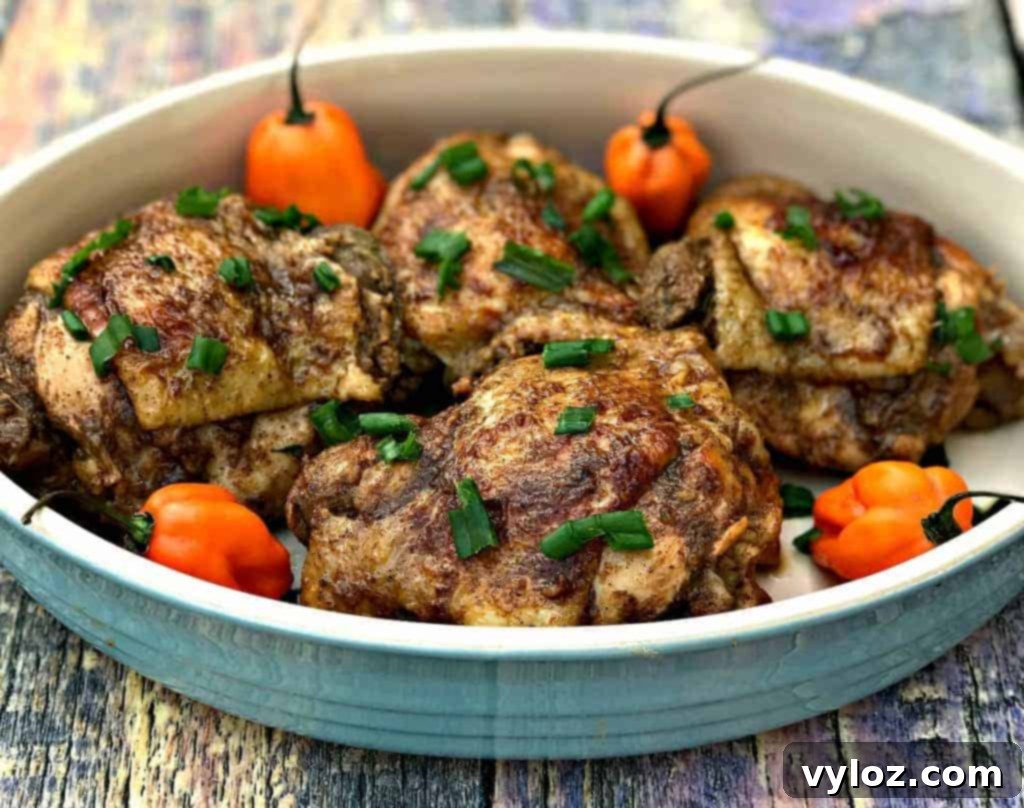 Flavorful Instant Pot Jamaican Jerk Chicken Thighs 6 Marinated chicken thighs searing in the Instant Pot before pressure cooking.