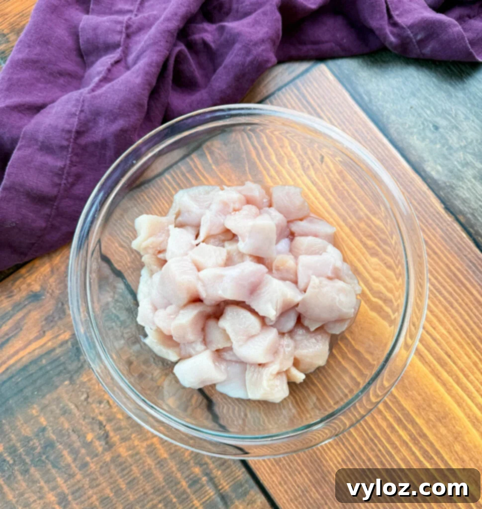 Protein-Packed Chicken Chili 4 raw sliced chicken breast in a glass bowl