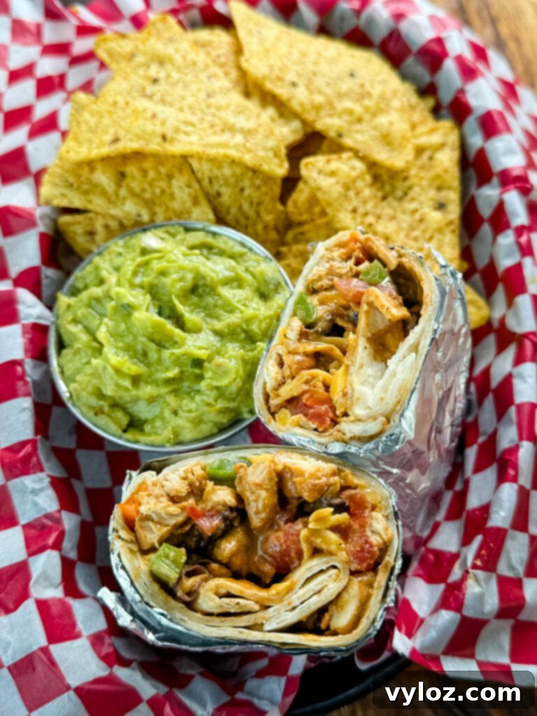 Ultimate Creamy Protein Chicken Burrito 2 High-Protein Chicken Burritos served with guacamole and chips