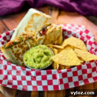 Ultimate Creamy Protein Chicken Burrito 13 High-Protein Chicken Burritos served with guacamole and chips