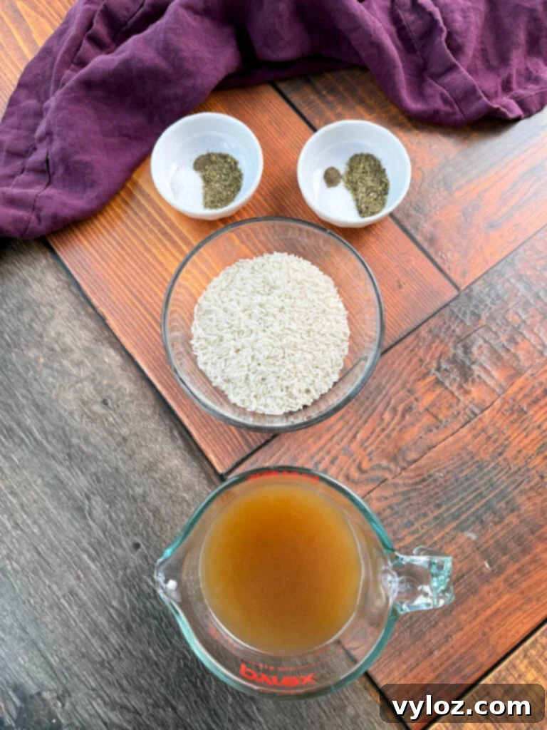Italian Seasoning, dry white rice, and chicken broth in separate glass bowls