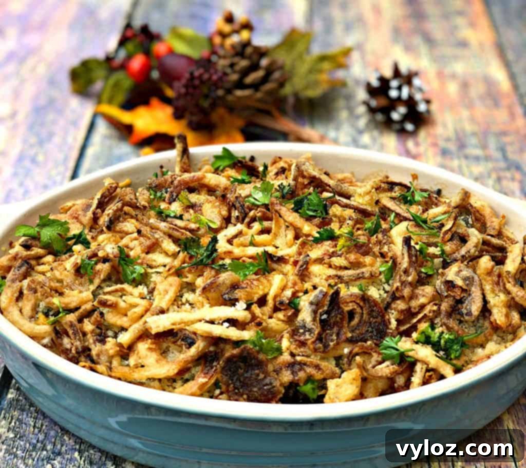 Instant Pot Green Bean Casserole with melted cheese and crispy fried onions, served in a white dish on a rustic wooden table.