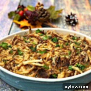 instant pot green bean casserole with cheese in a serving dish