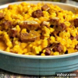 Instant Pot Baked Cheesy Corn with Ham served in a dish