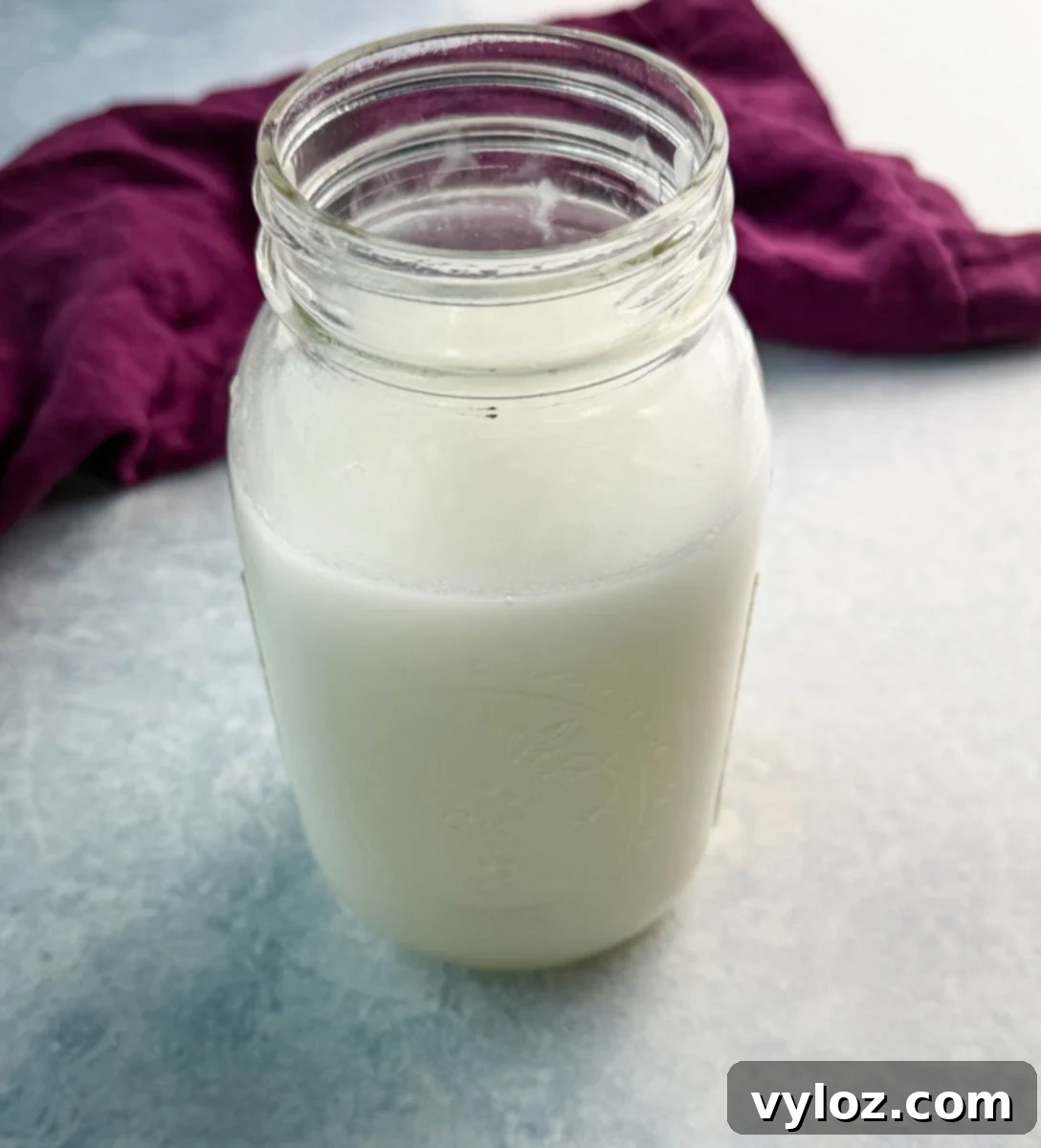 cream of coconut and water in a mason jar