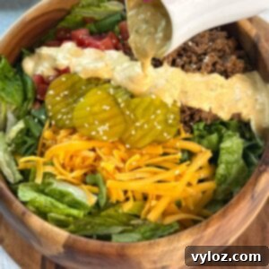 homemade big mac sauce drizzled over a burger salad bowl