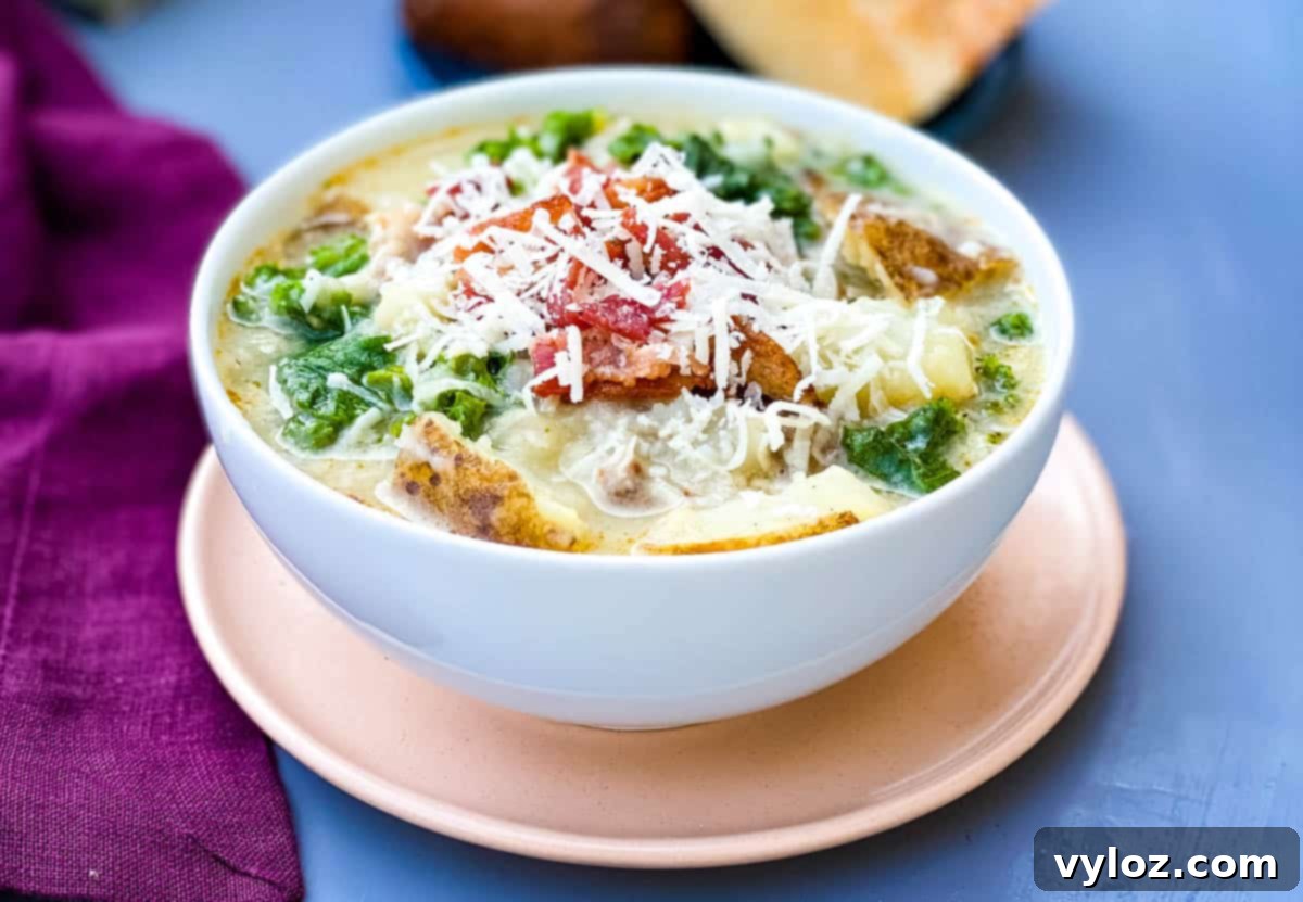 Instant Pot Zuppa Toscana Soup - a hearty, creamy soup with sausage, potatoes, and kale