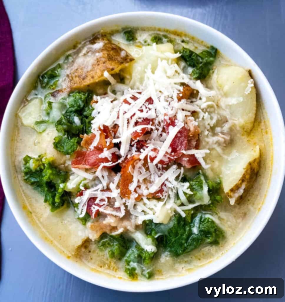 A bowl of Instant Pot Zuppa Toscana soup, garnished with Parmesan cheese, ready to be enjoyed