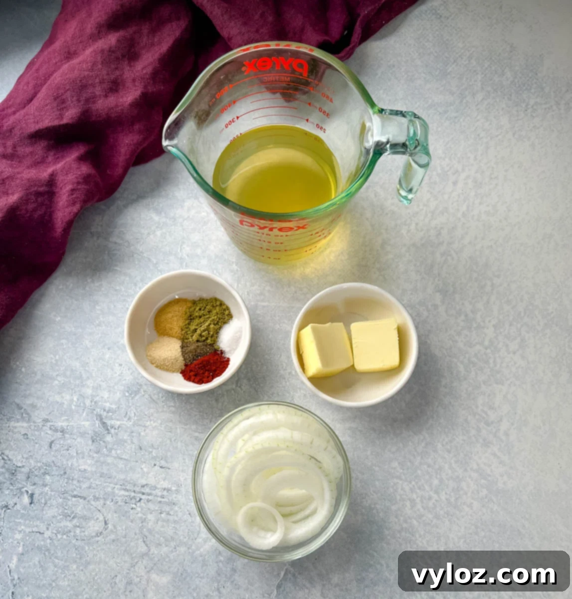 chicken broth, spices, butter, and sliced onions in separate bowls