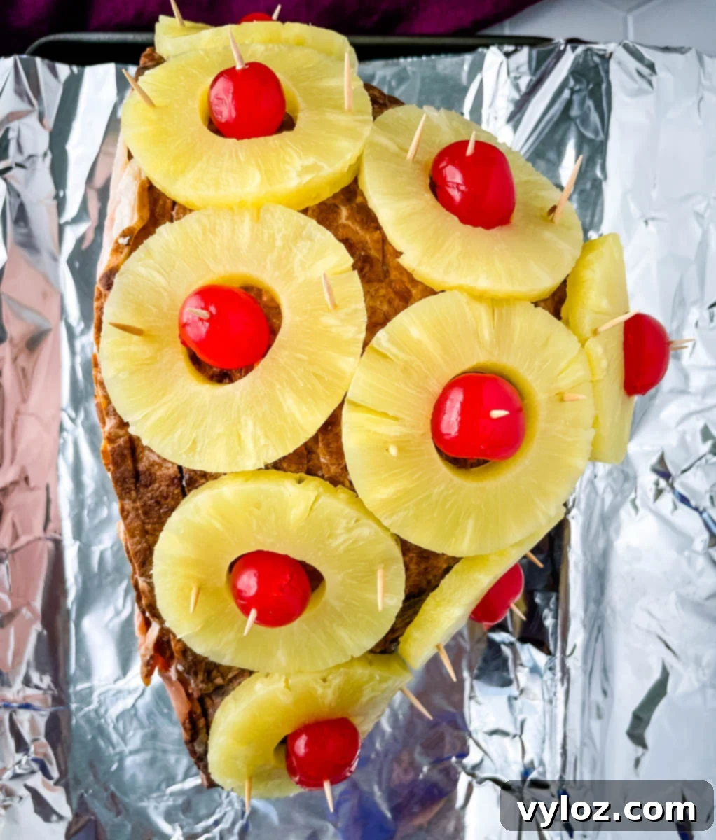 Pineapple glazed ham on a sheet pan