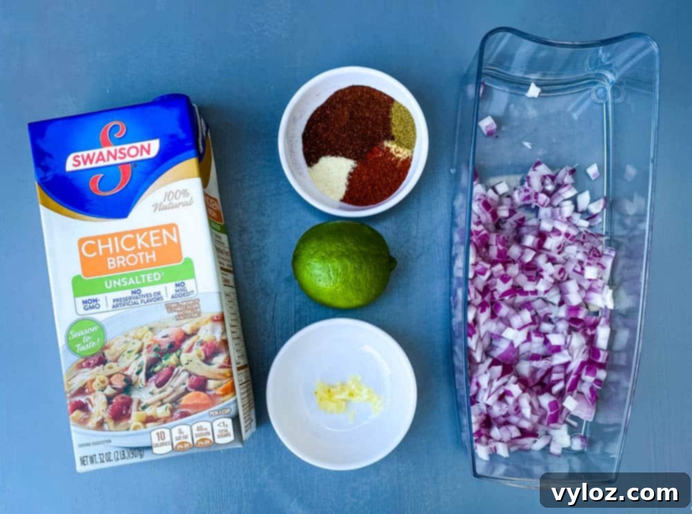 A close-up of a bowl of Instant Pot Chicken Tortilla Soup with avocado and cilantro garnish