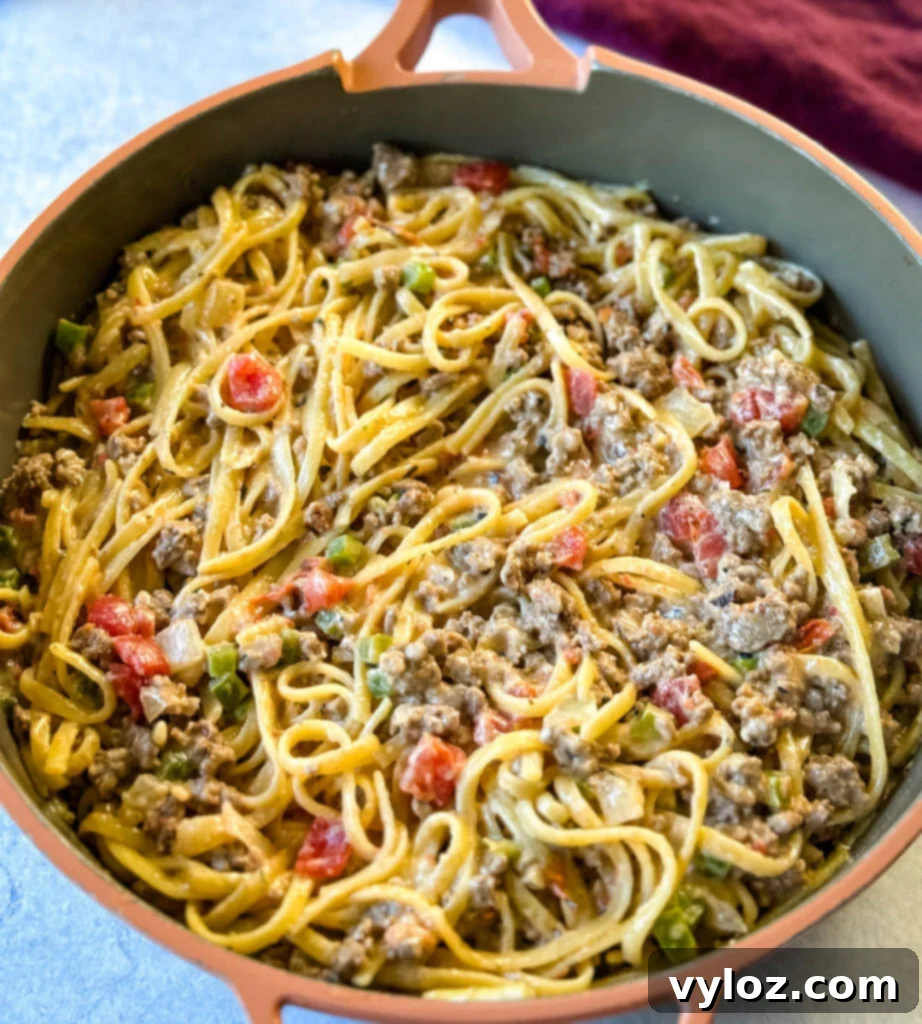 Hearty Ground Beef Alfredo 8 A large pan filled with creamy Ground Beef Alfredo Pasta, ready to be served.