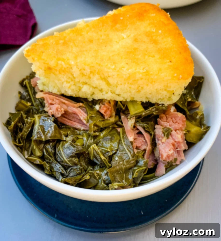 image of collard greens in a white bowl with cornbread