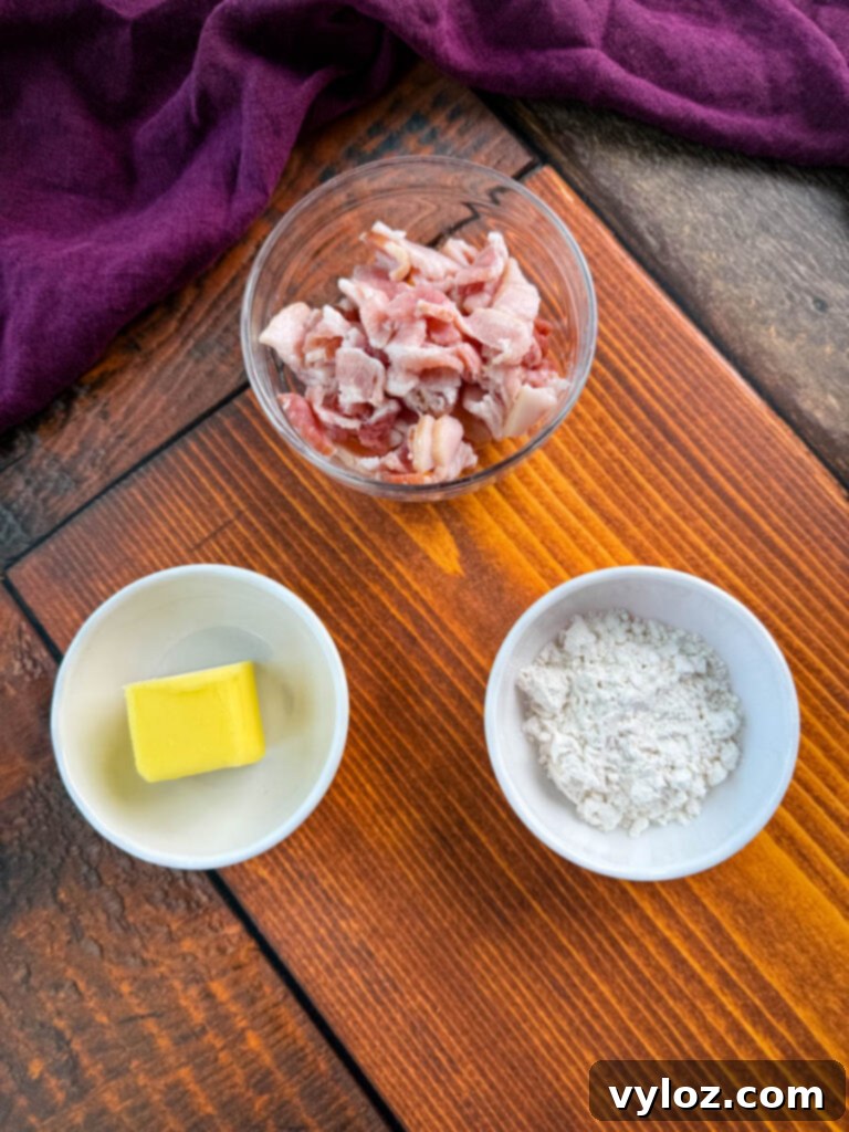 Bowls of diced bacon, unsalted butter, and all-purpose flour, ready for Southern creamed corn preparation.