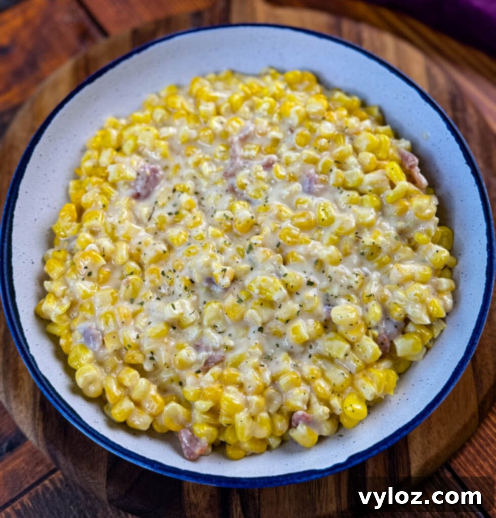 Close-up of Southern Soul Food Creamed Corn in a white bowl, showing its creamy texture.
