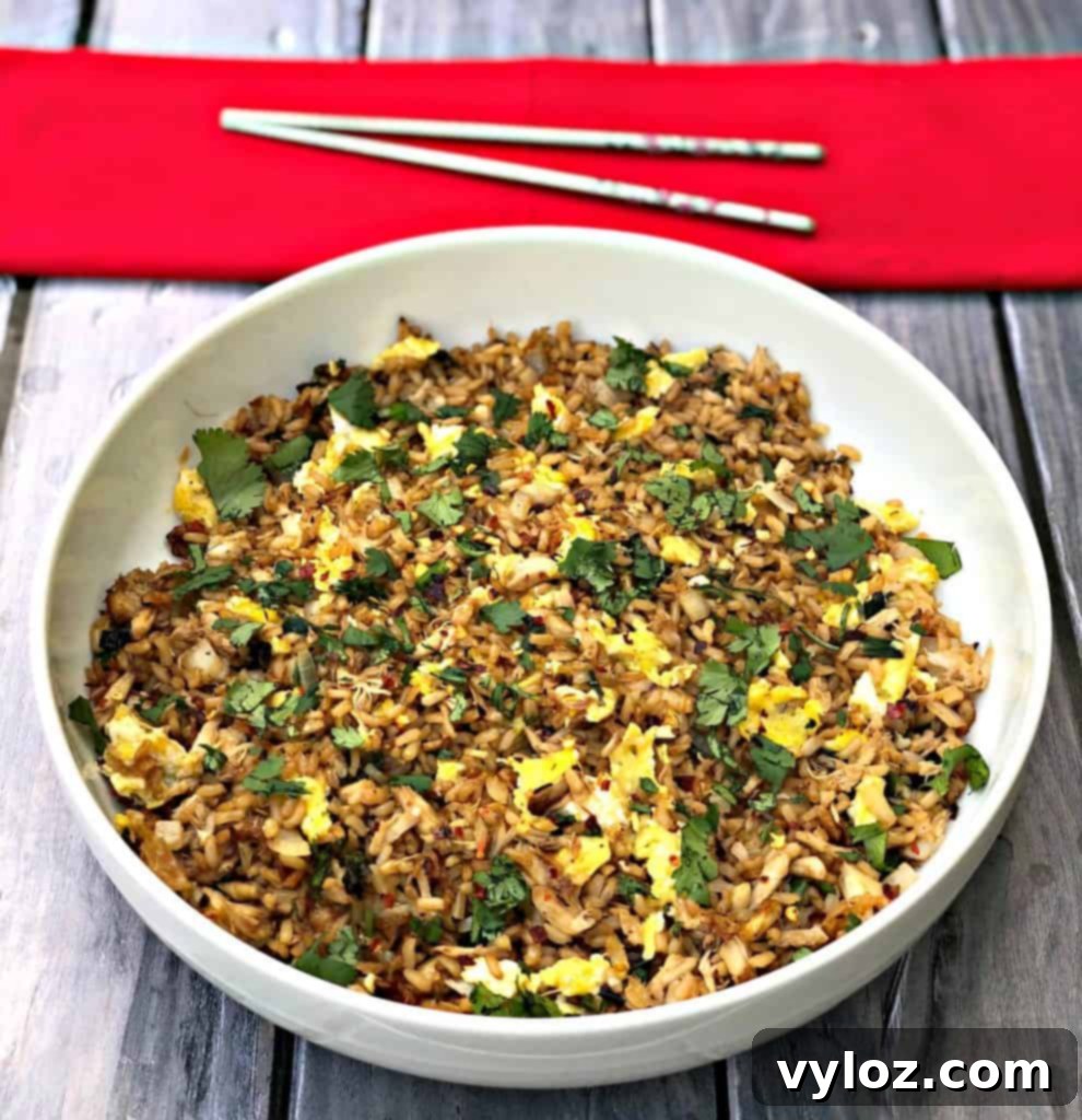 Close-up photo of deliciously crispy Air Fryer Crab Fried Rice, showing individual grains of rice and pieces of crab.