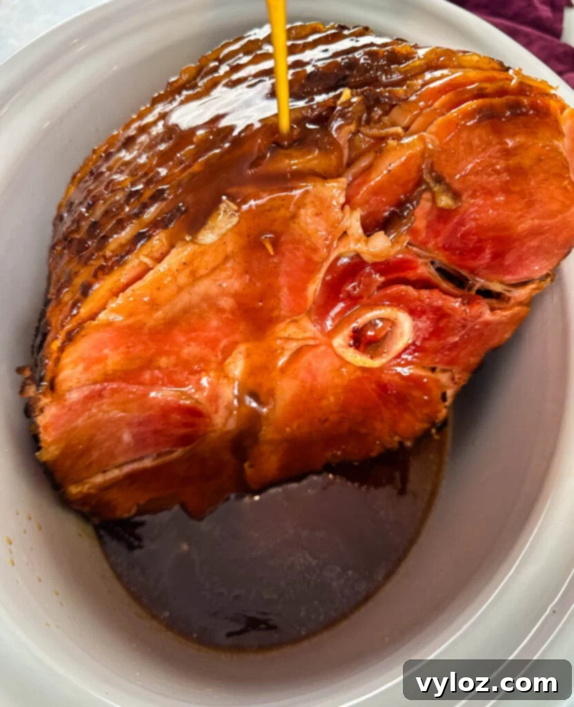 ham in a slow cooker Crockpot glazed with honey and brown sugar
