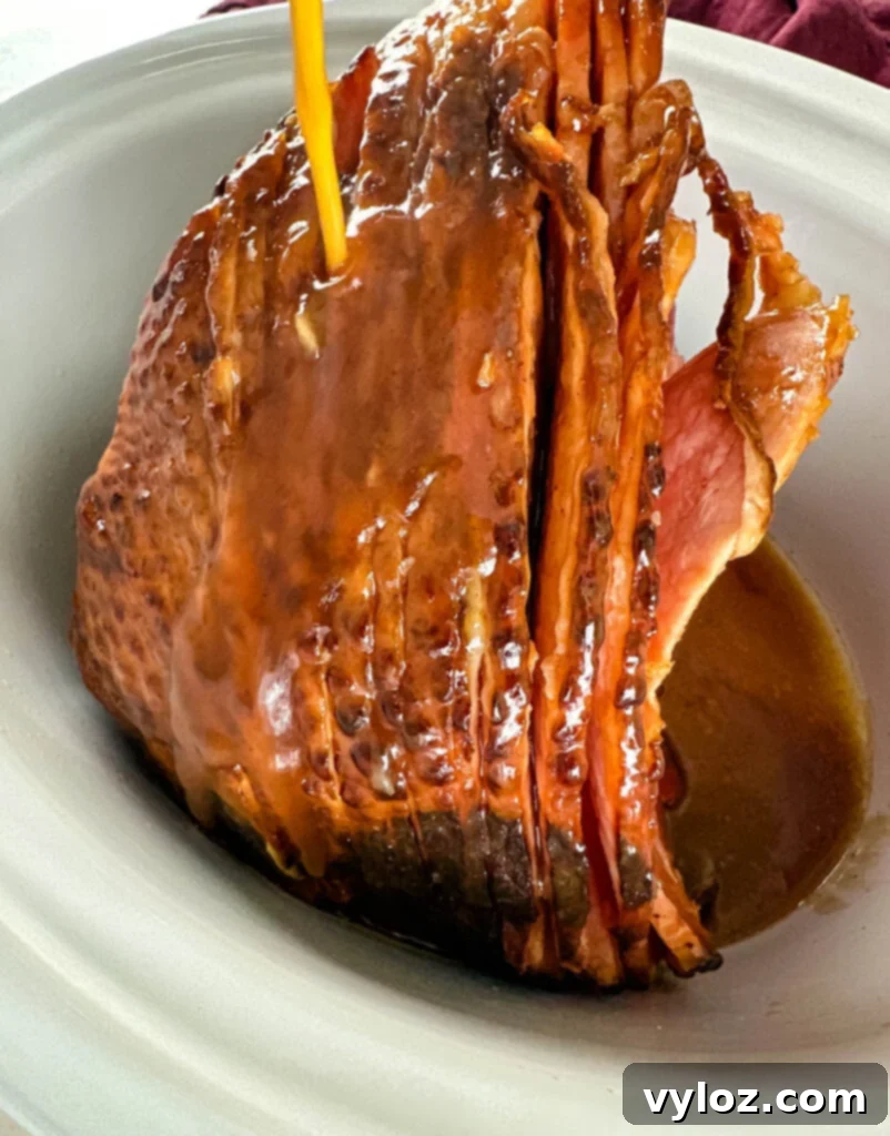 ham in a slow cooker Crockpot glazed with honey and brown sugar