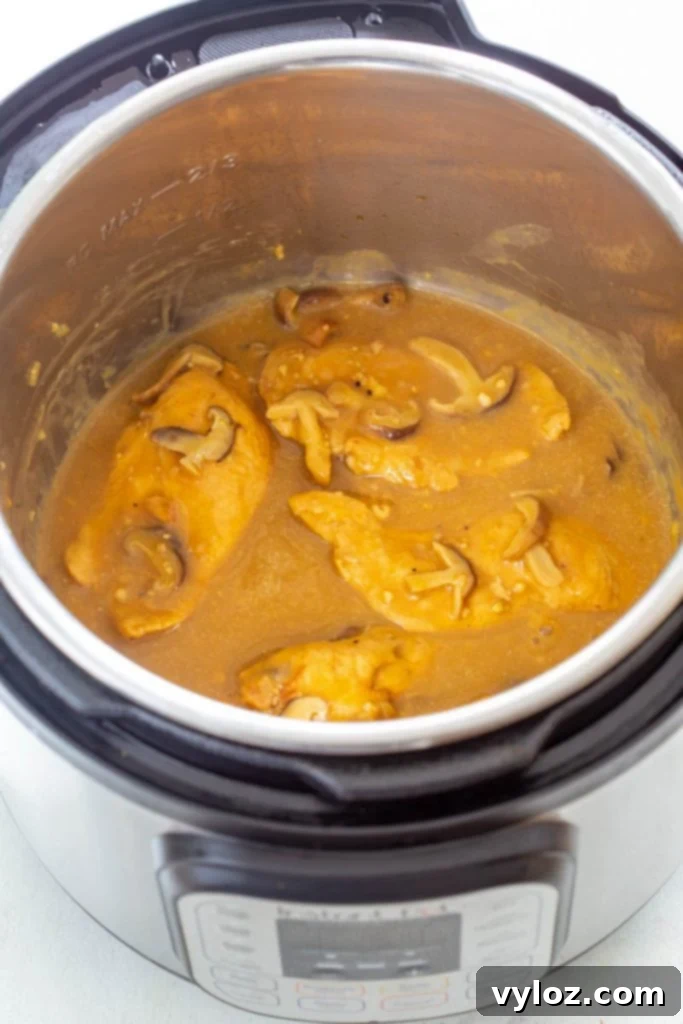 Close-up of chicken marsala in an Instant Pot, showing the rich, thick sauce.