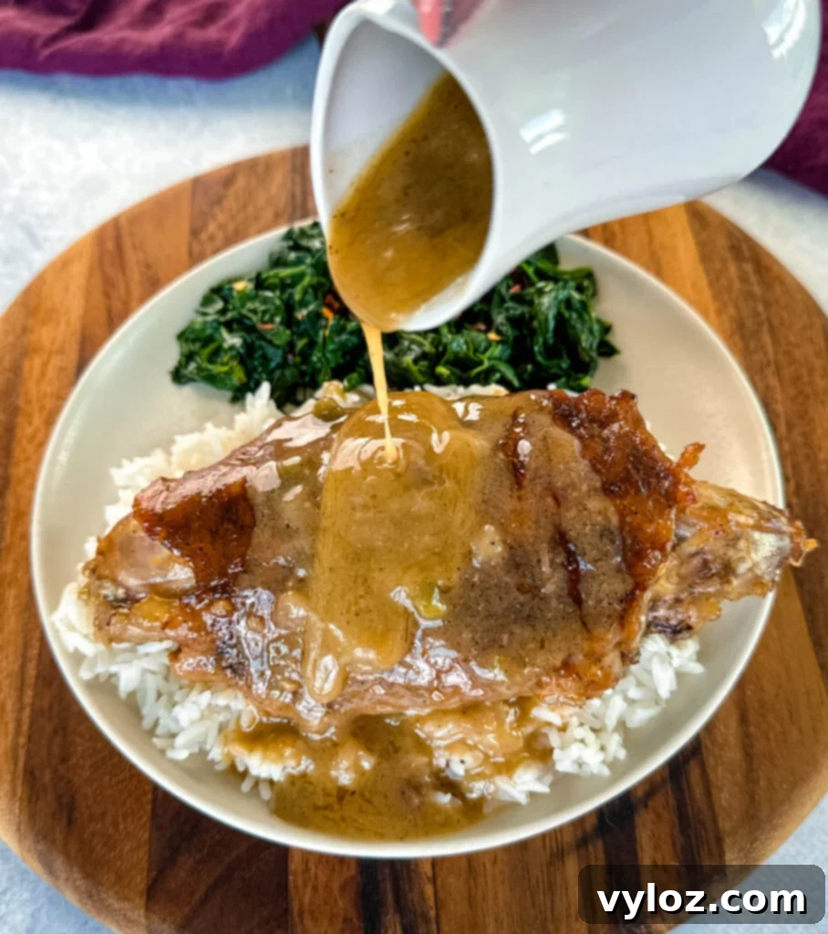 Soulful Smothered Turkey Wings 2 Delicious Southern Smothered Turkey Wings served on a plate with fresh spinach and drizzled with rich gravy