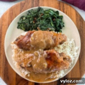 Soulful Smothered Turkey Wings 13 smothered turkey wings and gravy on a plate with white rice