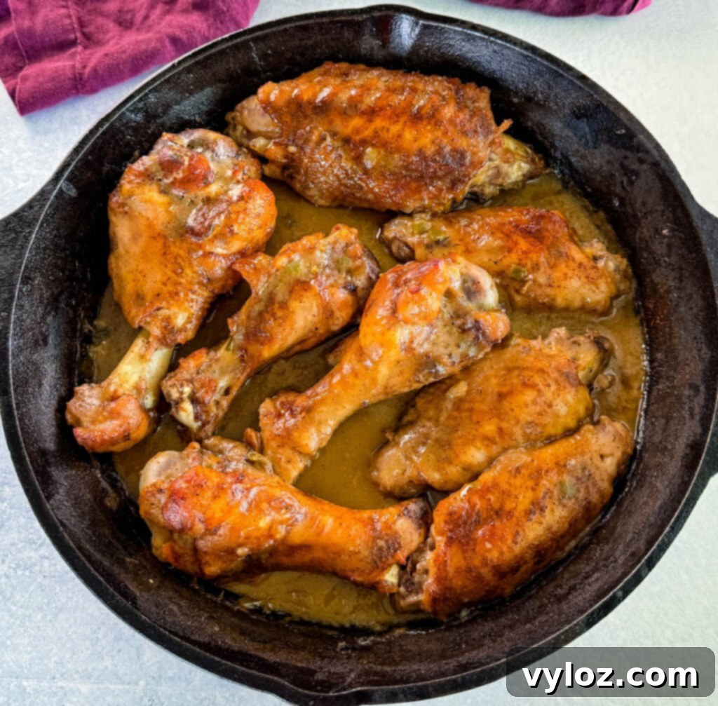 Soulful Smothered Turkey Wings 10 Perfectly cooked smothered turkey wings generously coated in rich brown gravy within a cast iron skillet