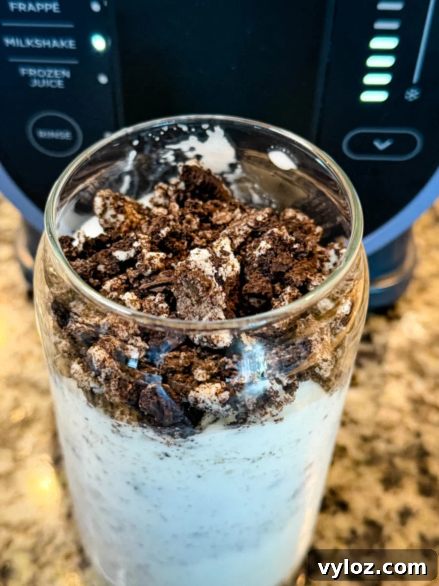 Stealthy Slushy Delight 9 Final Ninja Slushi McFlurry in a glass, topped with a generous amount of crushed Oreos.