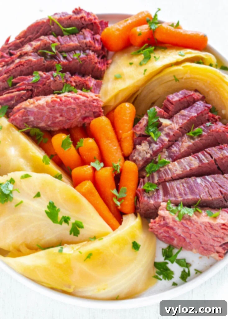 Instant Pot Corned Beef and Cabbage 7 A close-up shot of the cooked corned beef and vegetables in the Instant Pot, highlighting the steam and deliciousness.