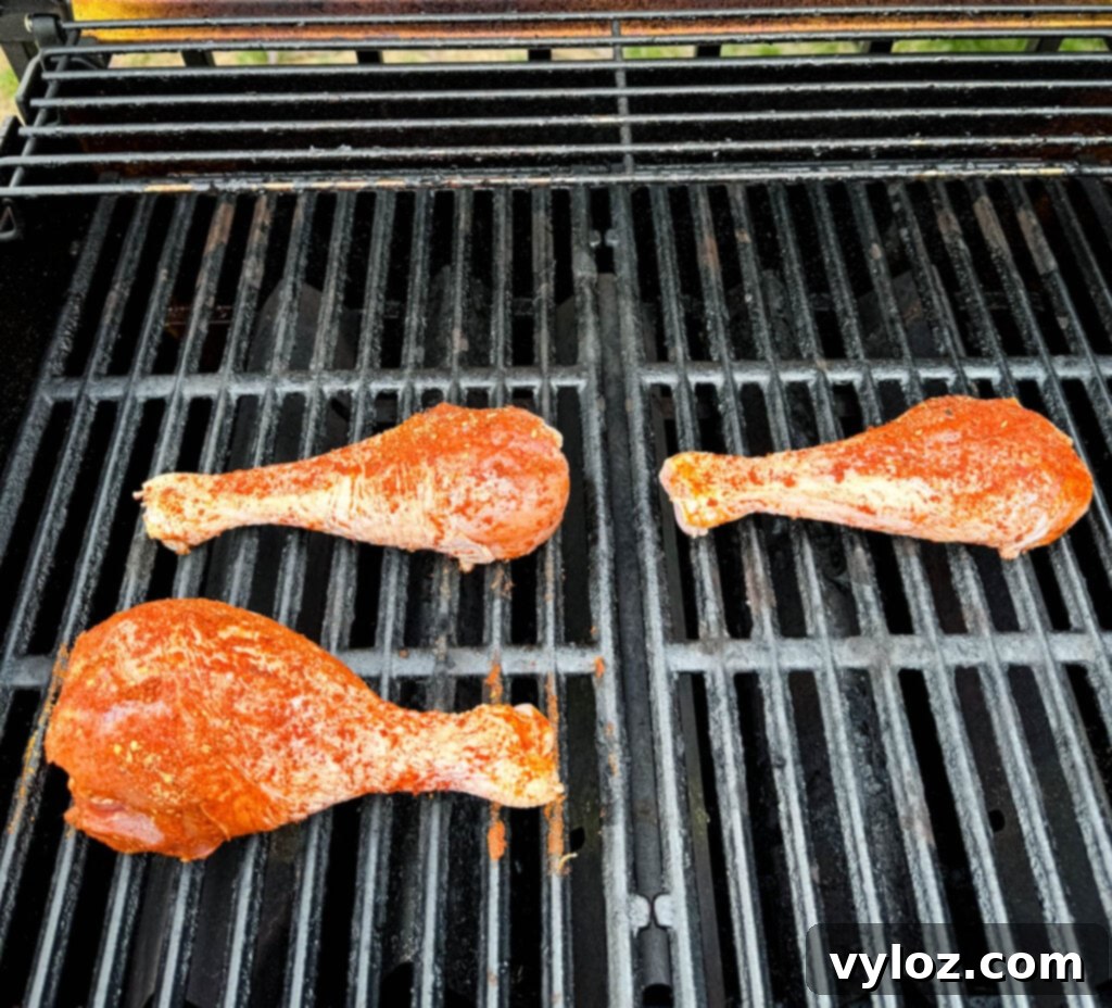raw, seasoned turkey legs on a grill