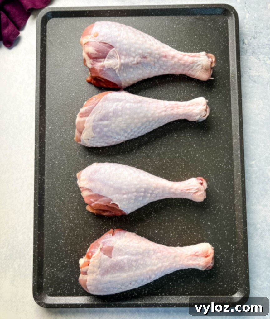 raw turkey legs on a flat surface