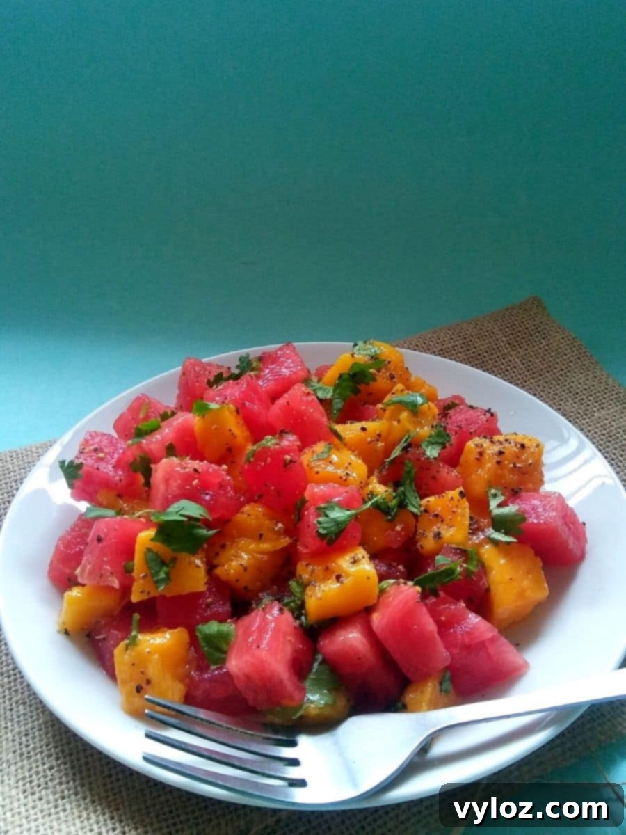 Vibrant Watermelon Mango Summer Salad with fresh herbs