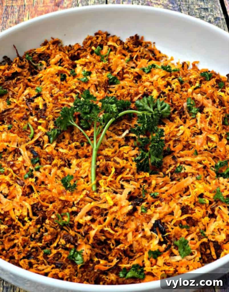 Sweet potato hash browns with fresh parsley in a white bowl, ready to be served