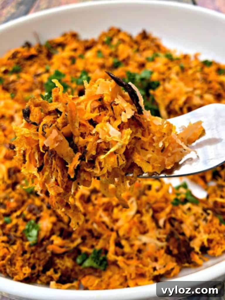 Sweet potato hash browns in a white bowl, ready to be enjoyed