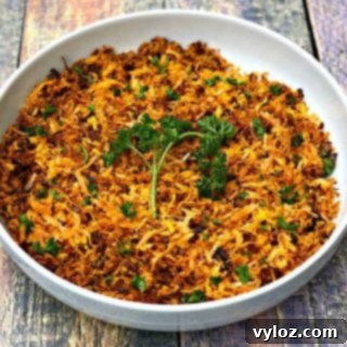 Sweet potato hash browns in a white bowl, garnished and ready