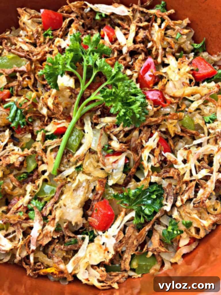 Perfectly Crispy Air Fryer Hash Browns 8 close up photo of air fryer hash browns with a fork, showing the texture