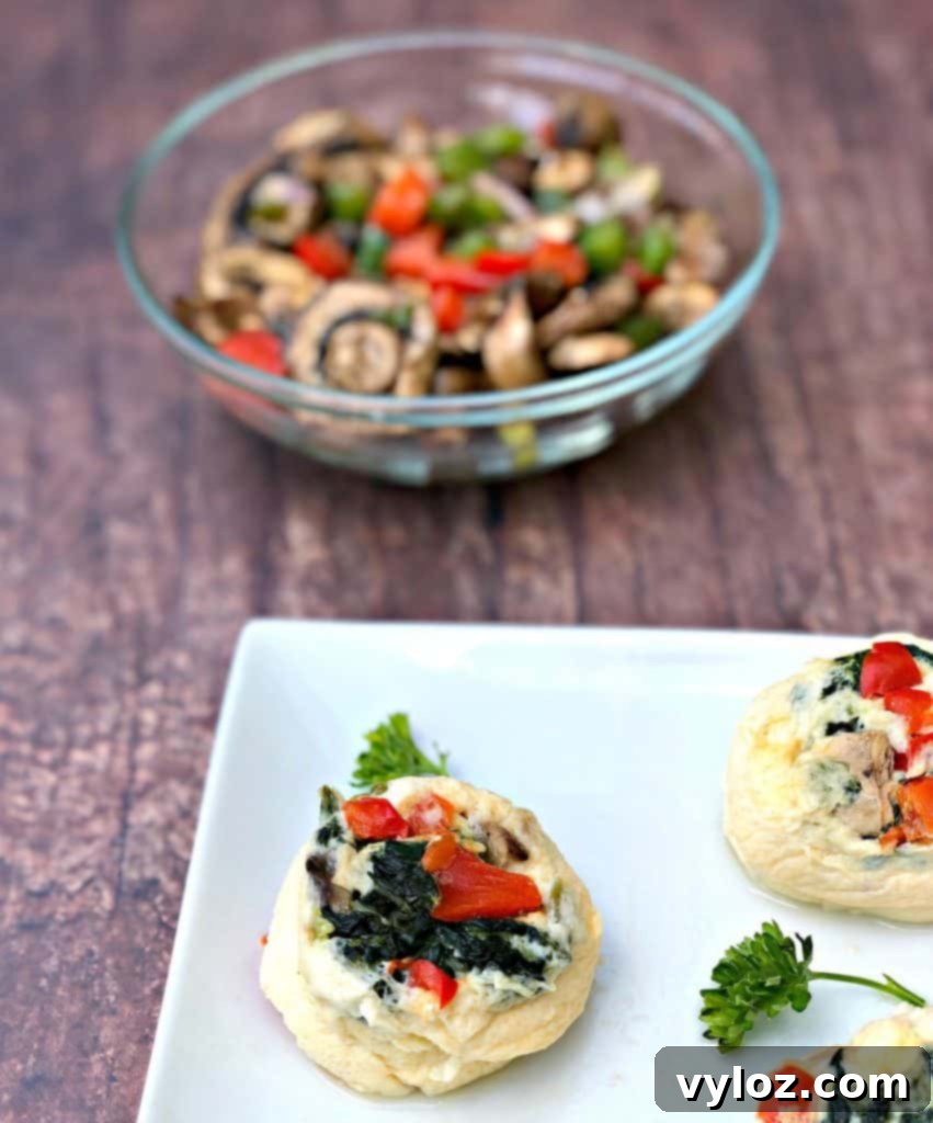 Keto Veggie Egg White Bites 8 A generous serving of Keto Low-Carb Egg White Omelet Vegetable Bites on a platter, showcasing their vibrant colors and appealing texture.