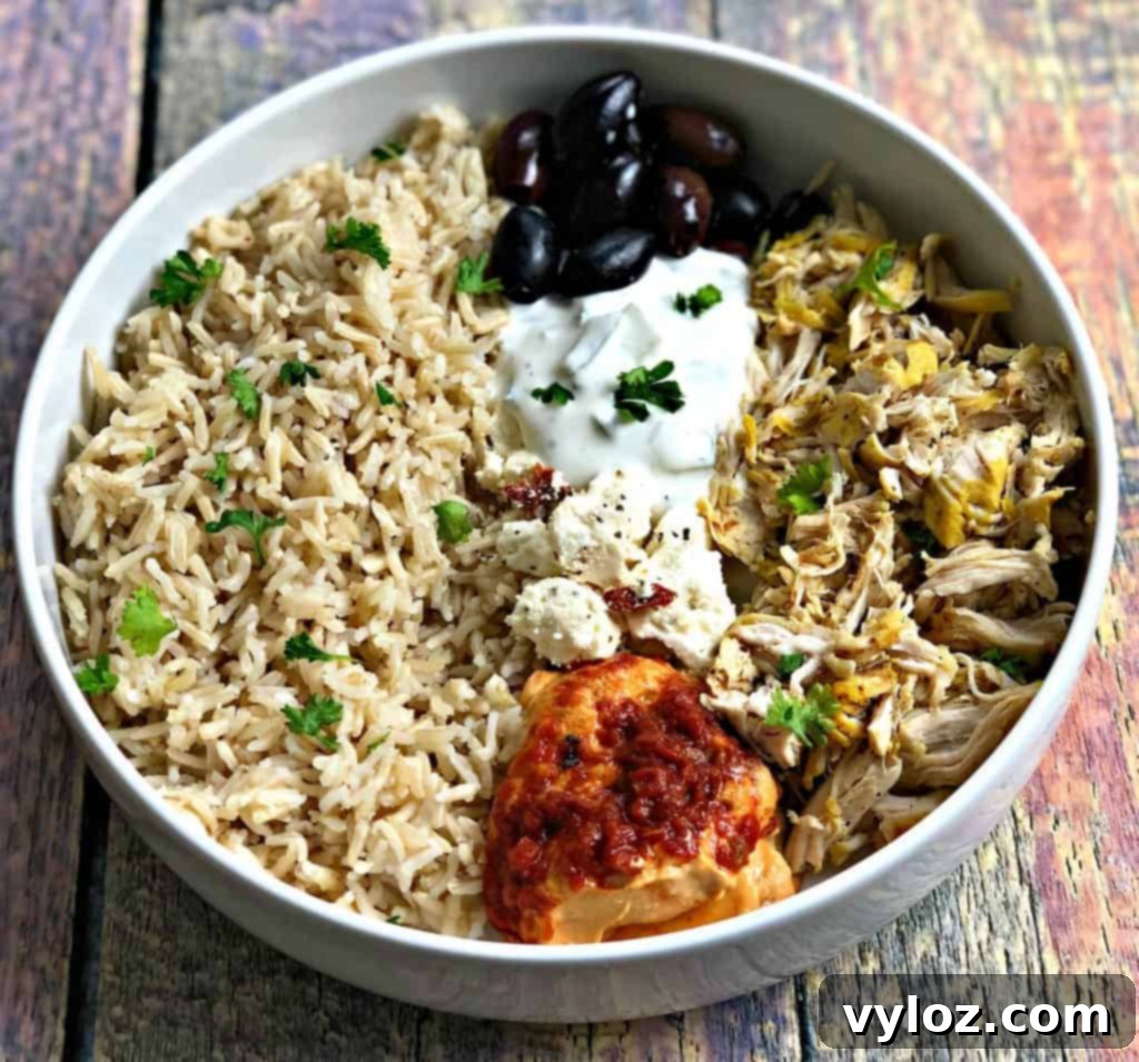 Vibrant Instant Pot Mediterranean Greek Shredded Chicken Brown Rice Bowls 2 mediterranean chicken bowl in a white bowl