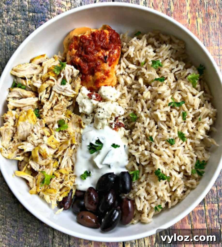 Vibrant Instant Pot Mediterranean Greek Shredded Chicken Brown Rice Bowls 4 mediterranean chicken bowl in a white bowl