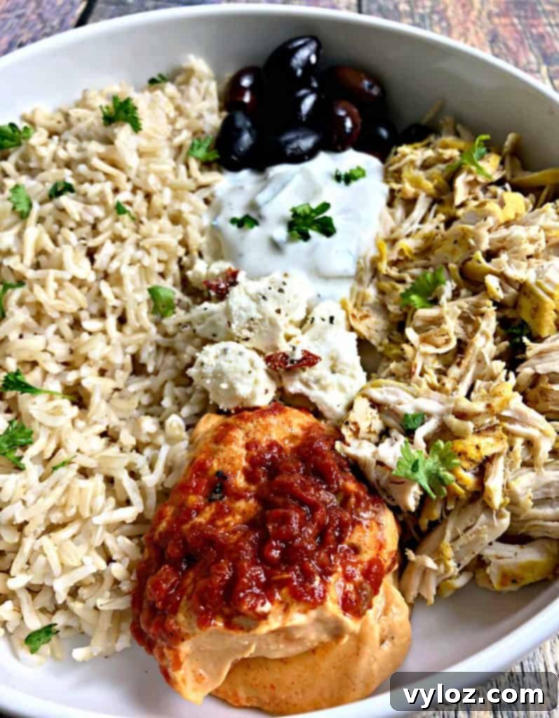 Vibrant Instant Pot Mediterranean Greek Shredded Chicken Brown Rice Bowls 6 mediterranean chicken bowl in a white bowl