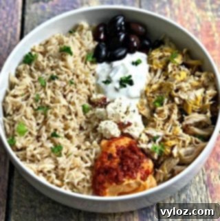 Vibrant Instant Pot Mediterranean Greek Shredded Chicken Brown Rice Bowls 9 mediterranean chicken bowl in a white bowl